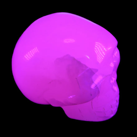 Mangano Calcite skull 45*60*57mm 199g in UV light - Rocks and Things Store