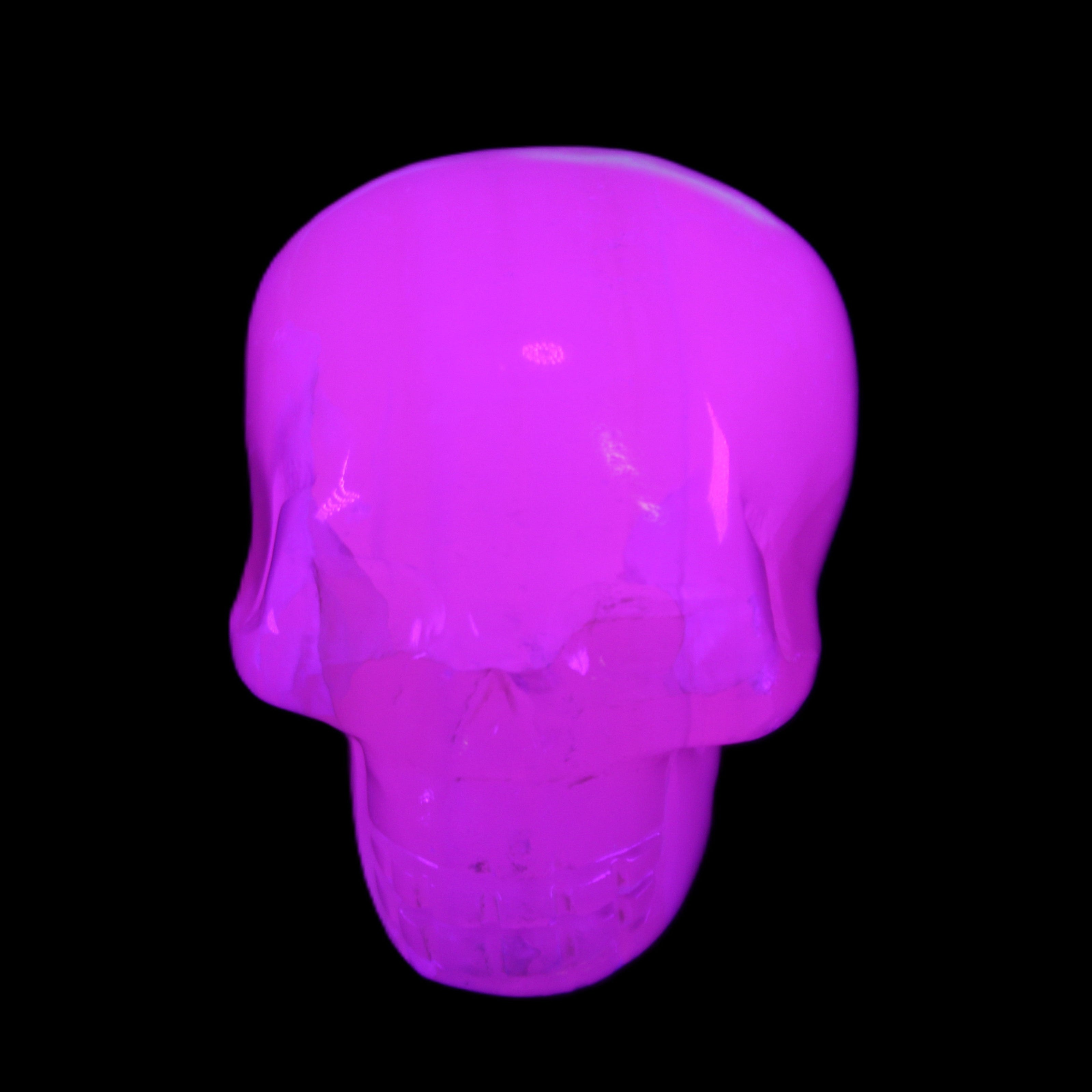 Mangano Calcite skull 45*60*57mm 199g in UV light - Rocks and Things Store