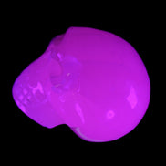 Mangano Calcite skull 45*60*57mm 199g in UV light - Rocks and Things Store