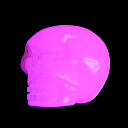 Mangano Calcite skull 45*60*57mm 199g in UV light - Rocks and Things Store