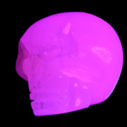 Mangano Calcite skull 45*60*57mm 199g in UV light - Rocks and Things Store