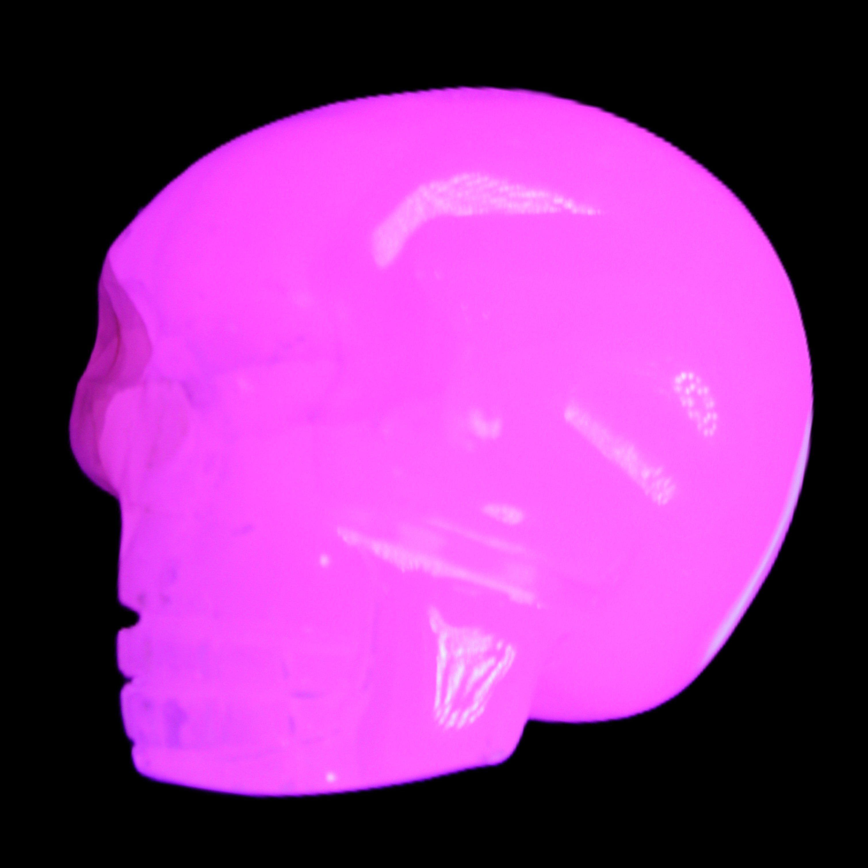 Mangano Calcite skull 45*60*57mm 199g in UV light - Rocks and Things Store