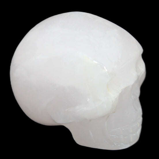 Mangano Calcite skull 45*60*57mm 199g in sunlight - Rocks and Things Store