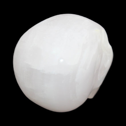 Mangano Calcite skull 45*60*57mm 199g in sunlight - Rocks and Things Store