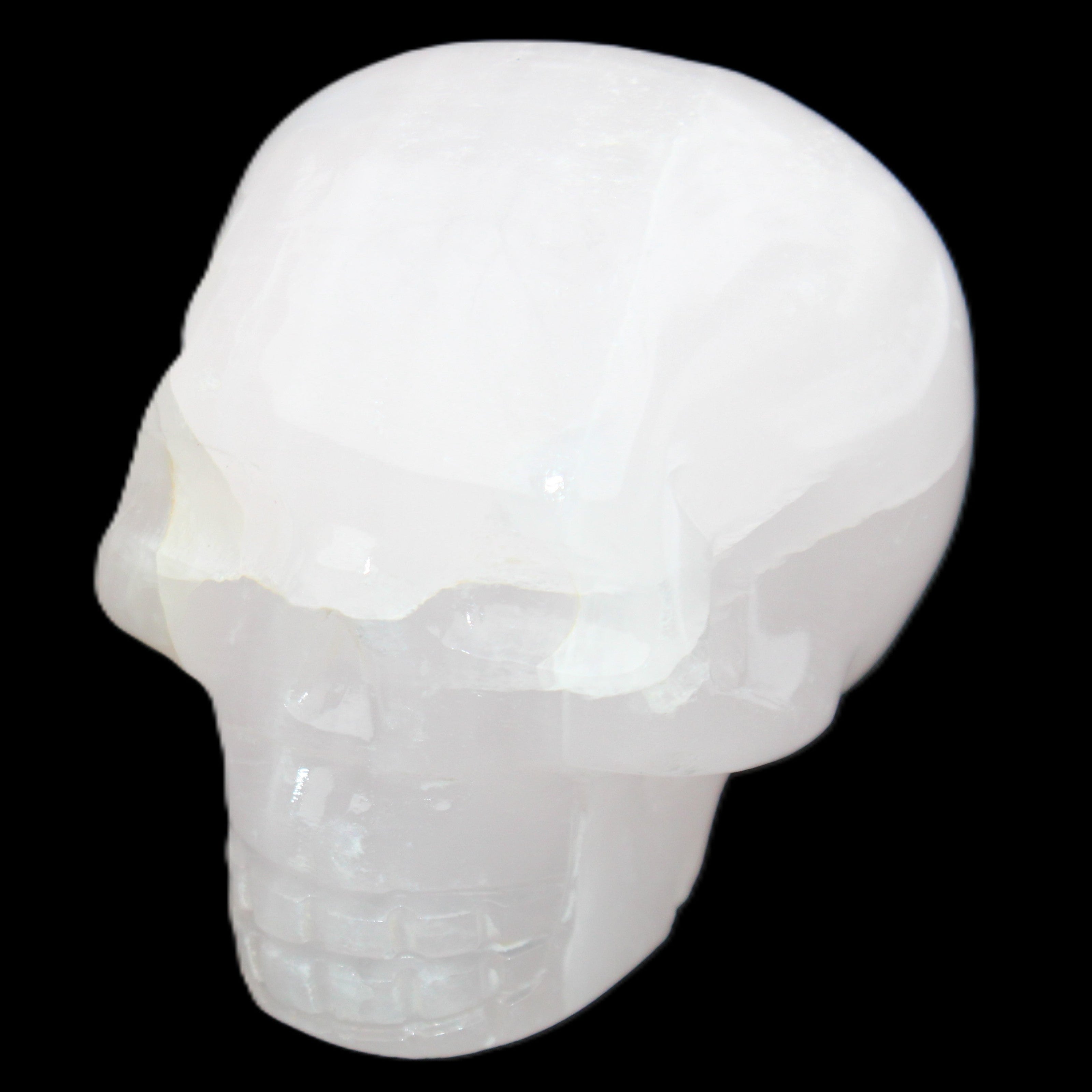 Mangano Calcite skull 45*60*57mm 199g in sunlight - Rocks and Things Store