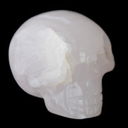 Mangano Calcite skull 45*60*57mm 199g in sunlight - Rocks and Things Store