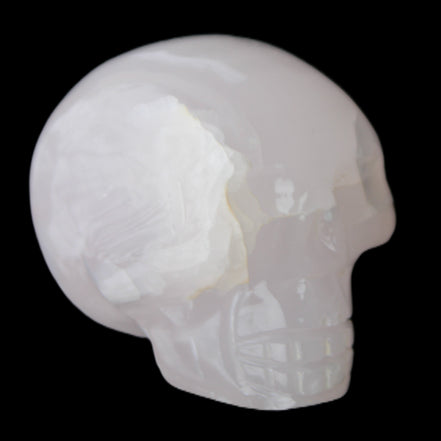 Mangano Calcite skull 45*60*57mm 199g in sunlight - Rocks and Things Store