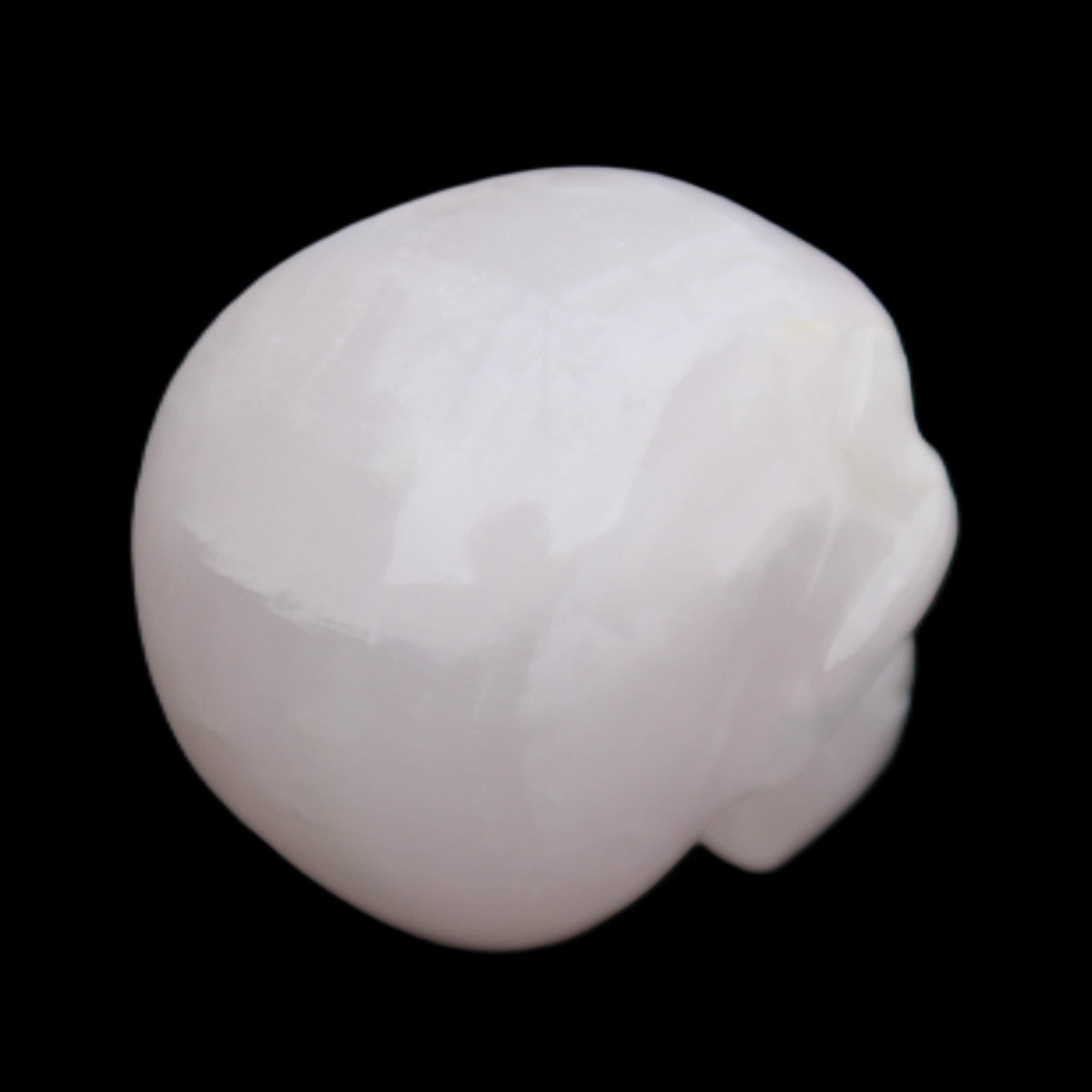 Mangano Calcite skull 45*60*57mm 199g in sunlight - Rocks and Things Store