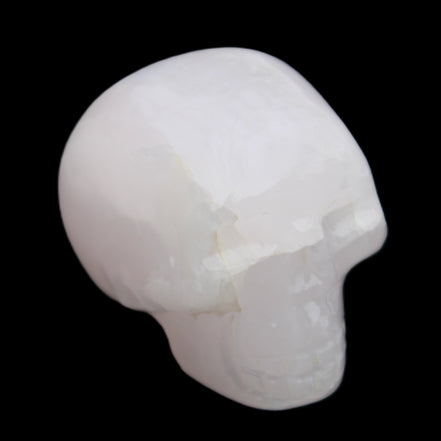 Mangano Calcite skull 45*60*57mm 199g in sunlight - Rocks and Things Store