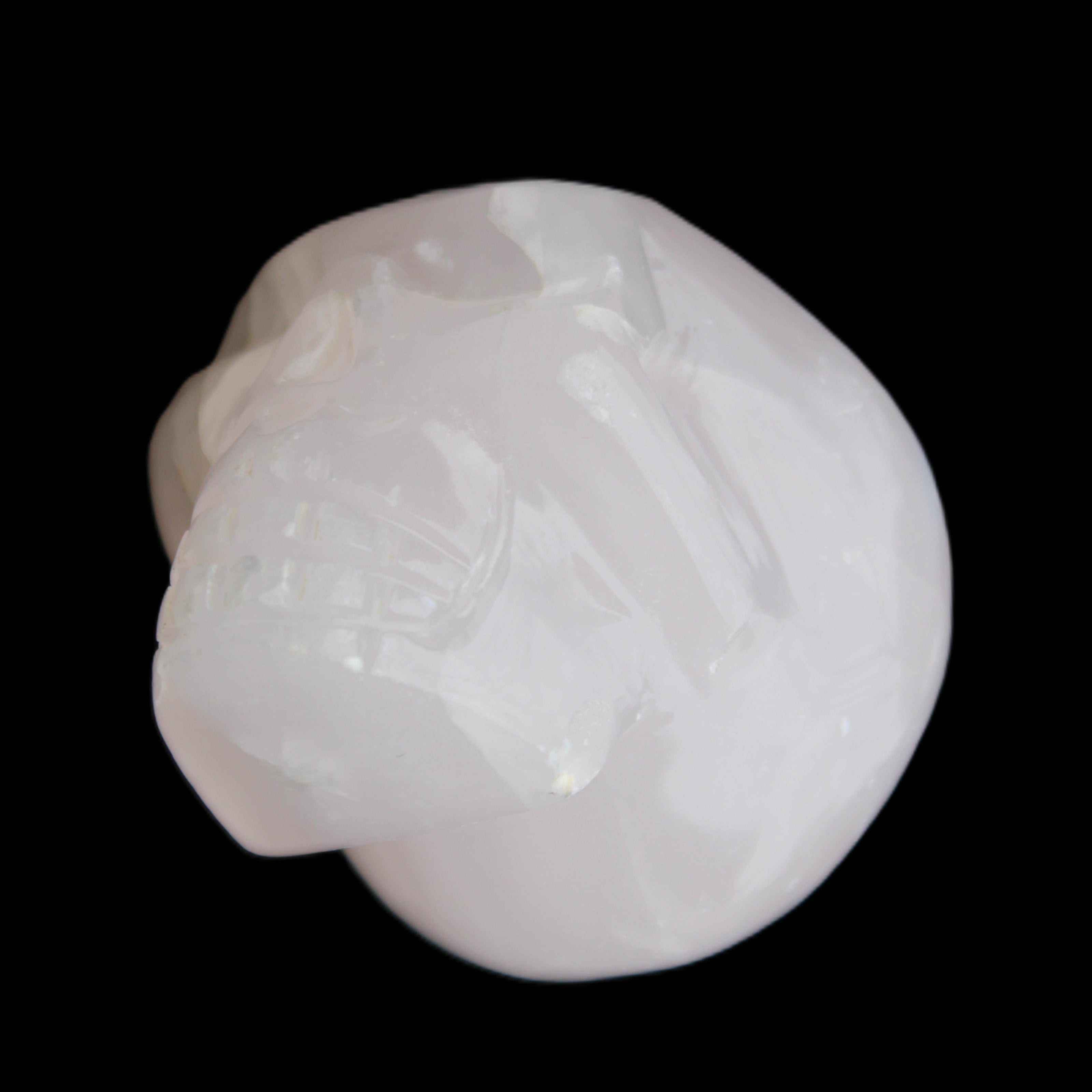 Mangano Calcite skull 45*60*57mm 199g in sunlight - Rocks and Things Store