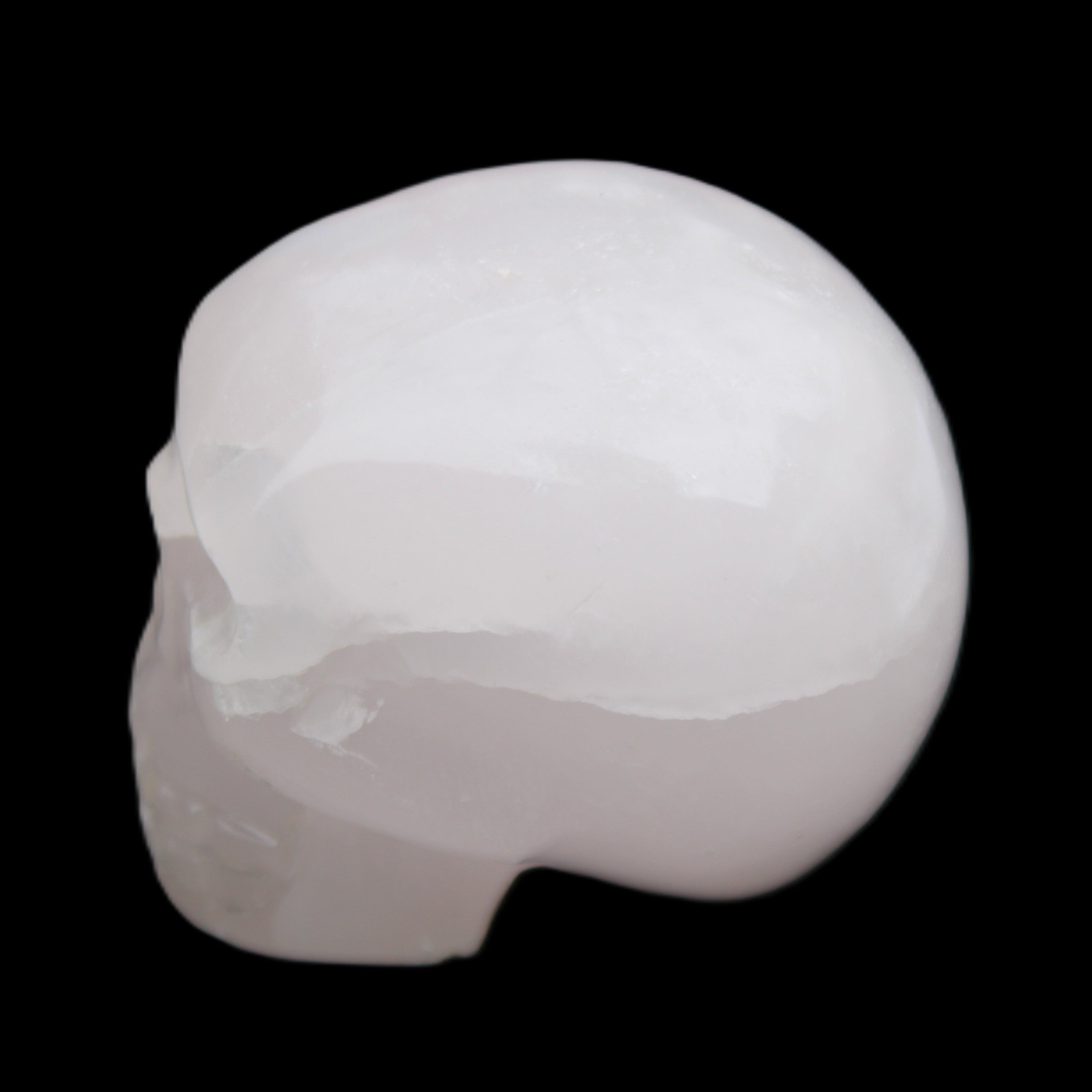 Mangano Calcite skull 45*60*57mm 199g in sunlight - Rocks and Things Store