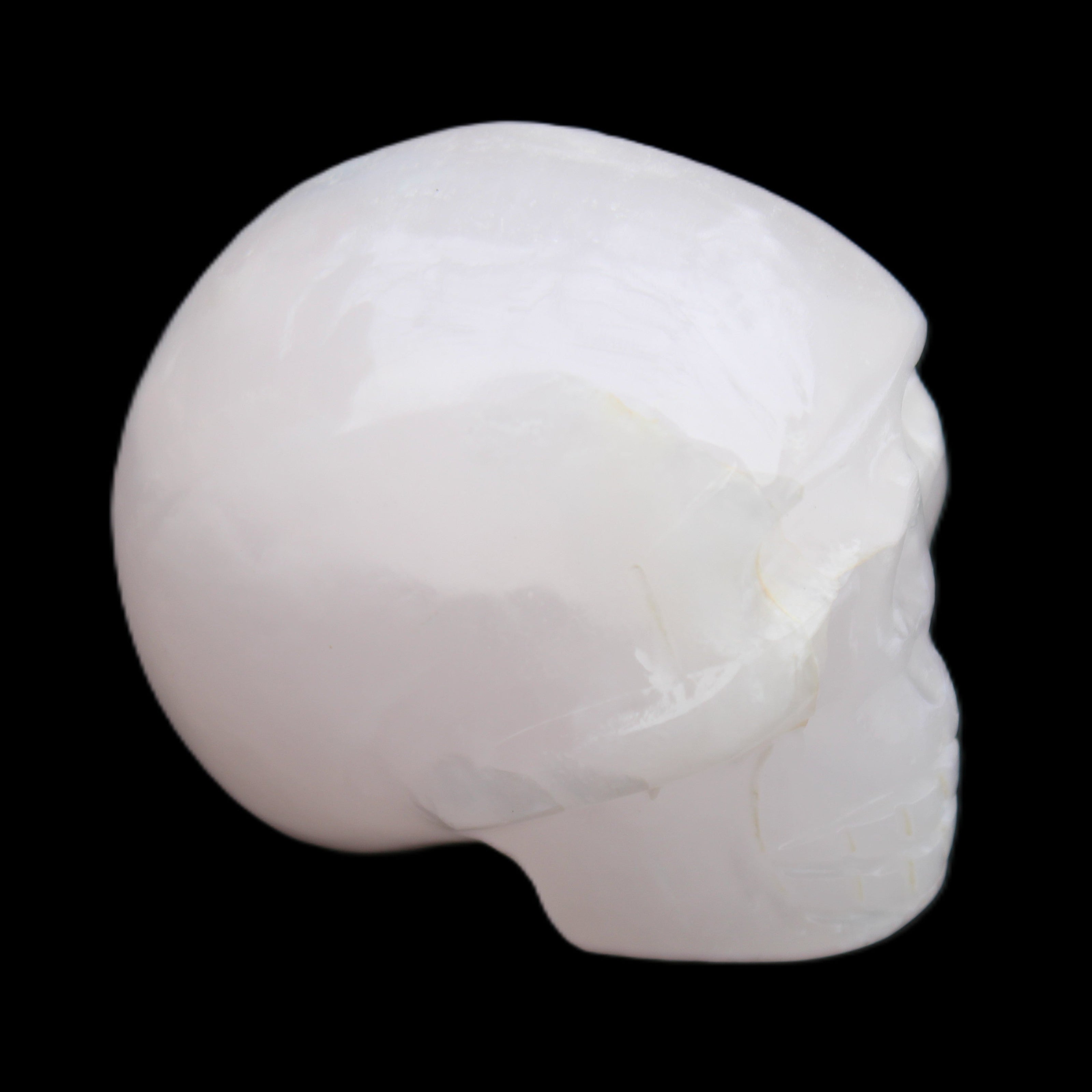 Mangano Calcite skull 45*60*57mm 199g in sunlight - Rocks and Things Store