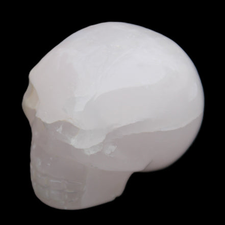 Mangano Calcite skull 45*60*57mm 199g in sunlight - Rocks and Things Store