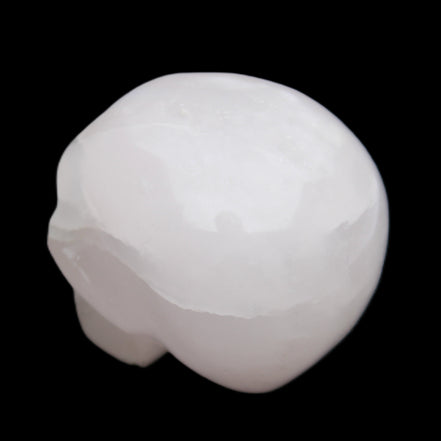 Mangano Calcite skull 45*60*57mm 199g in sunlight - Rocks and Things Store