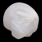 Mangano Calcite skull 45*60*57mm 199g in sunlight - Rocks and Things Store