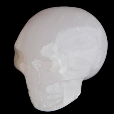 Mangano Calcite skull 45*60*57mm 199g in sunlight - Rocks and Things Store