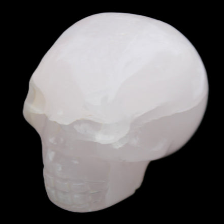 Mangano Calcite skull 45*60*57mm 199g in sunlight - Rocks and Things Store