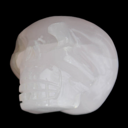 Mangano Calcite skull 45*60*57mm 199g in sunlight - Rocks and Things Store
