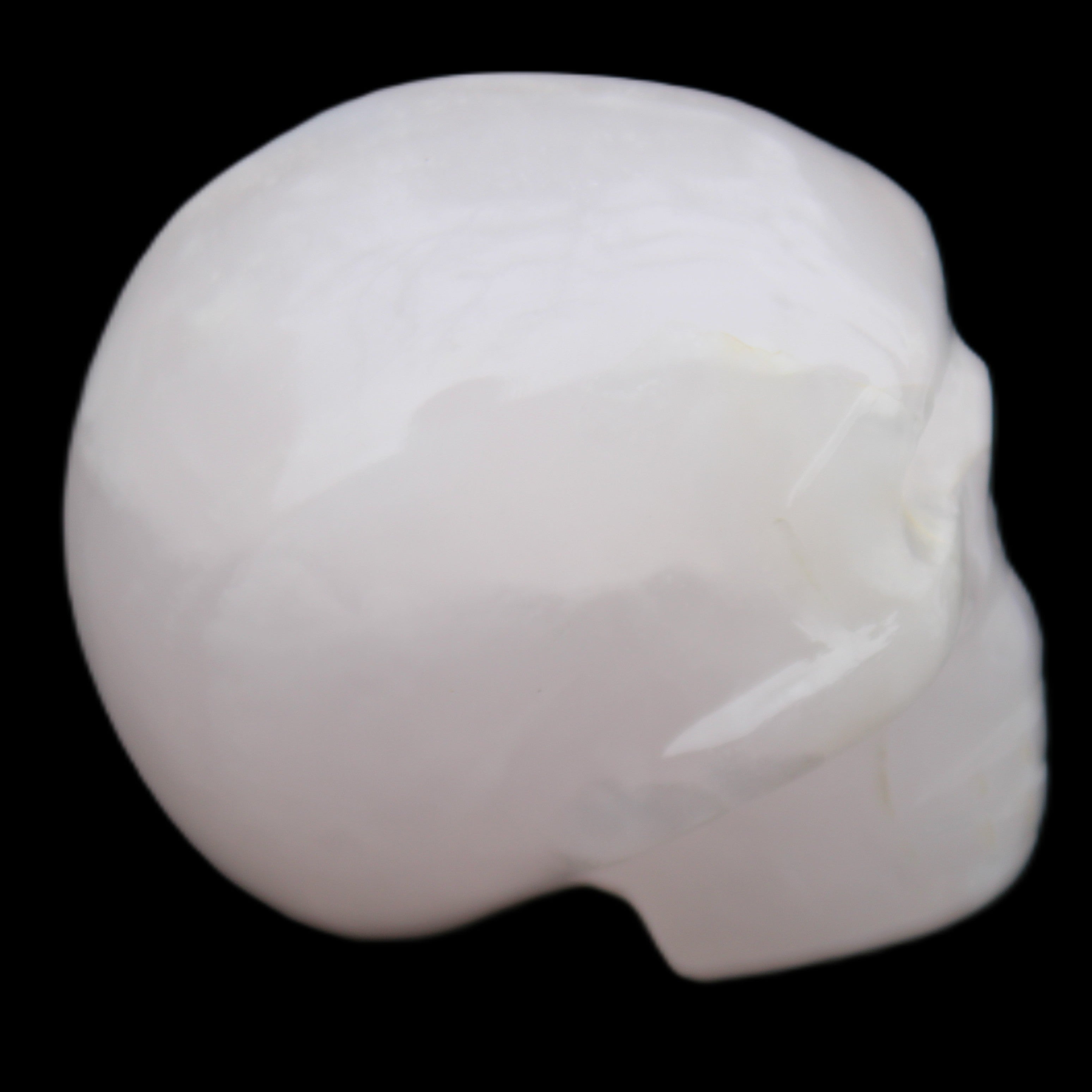 Mangano Calcite skull 45*60*57mm 199g in sunlight - Rocks and Things Store