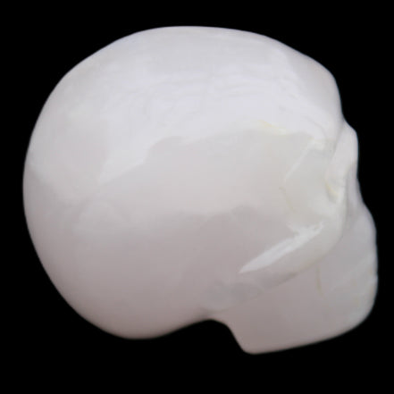 Mangano Calcite skull 45*60*57mm 199g in sunlight - Rocks and Things Store