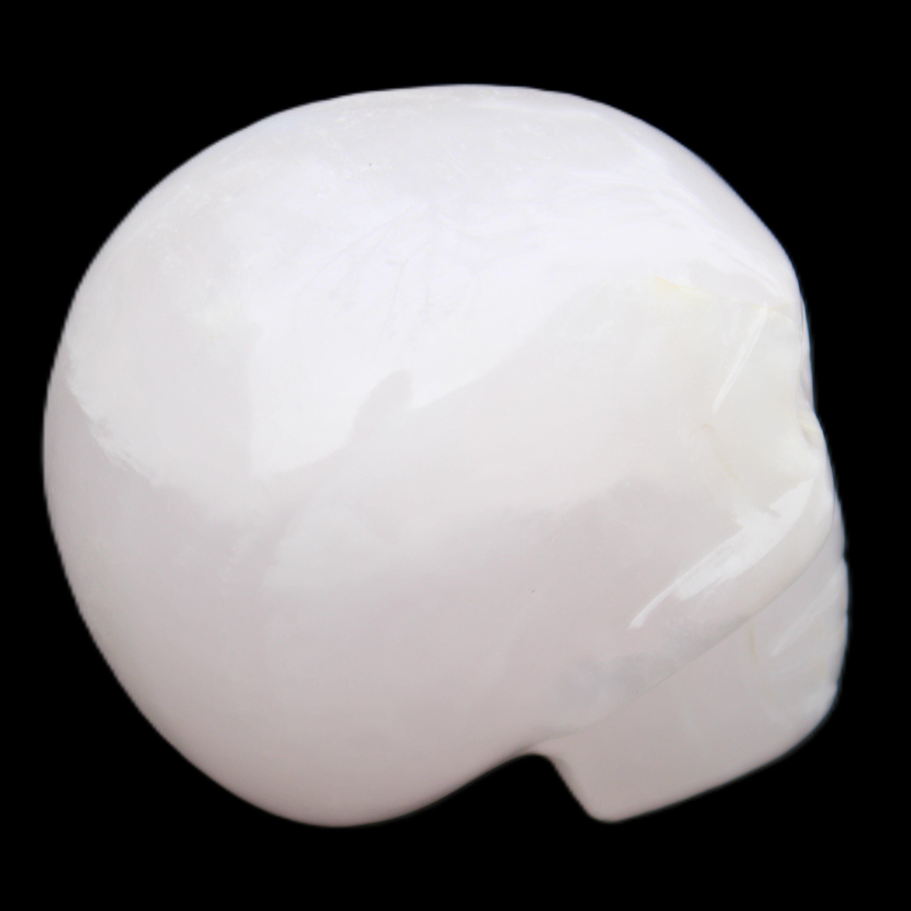 Mangano Calcite skull 45*60*57mm 199g in sunlight - Rocks and Things Store