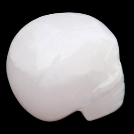 Mangano Calcite skull 45*60*57mm 199g in sunlight - Rocks and Things Store