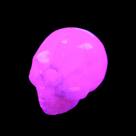 Mangano Calcite skull 30*42*35mm 77g in UV light - Rocks and Things Store
