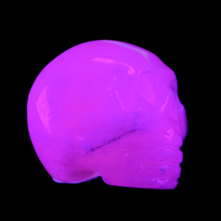 Mangano Calcite skull 30*42*35mm 77g in UV light - Rocks and Things Store