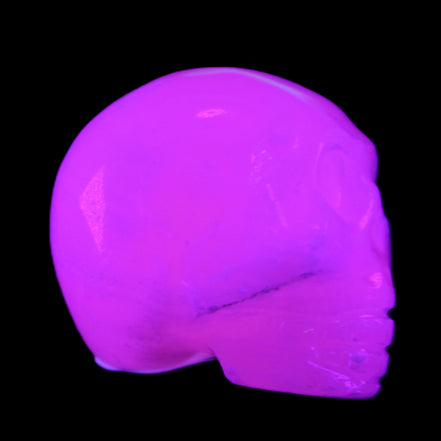 Mangano Calcite skull 30*42*35mm 77g in UV light - Rocks and Things Store