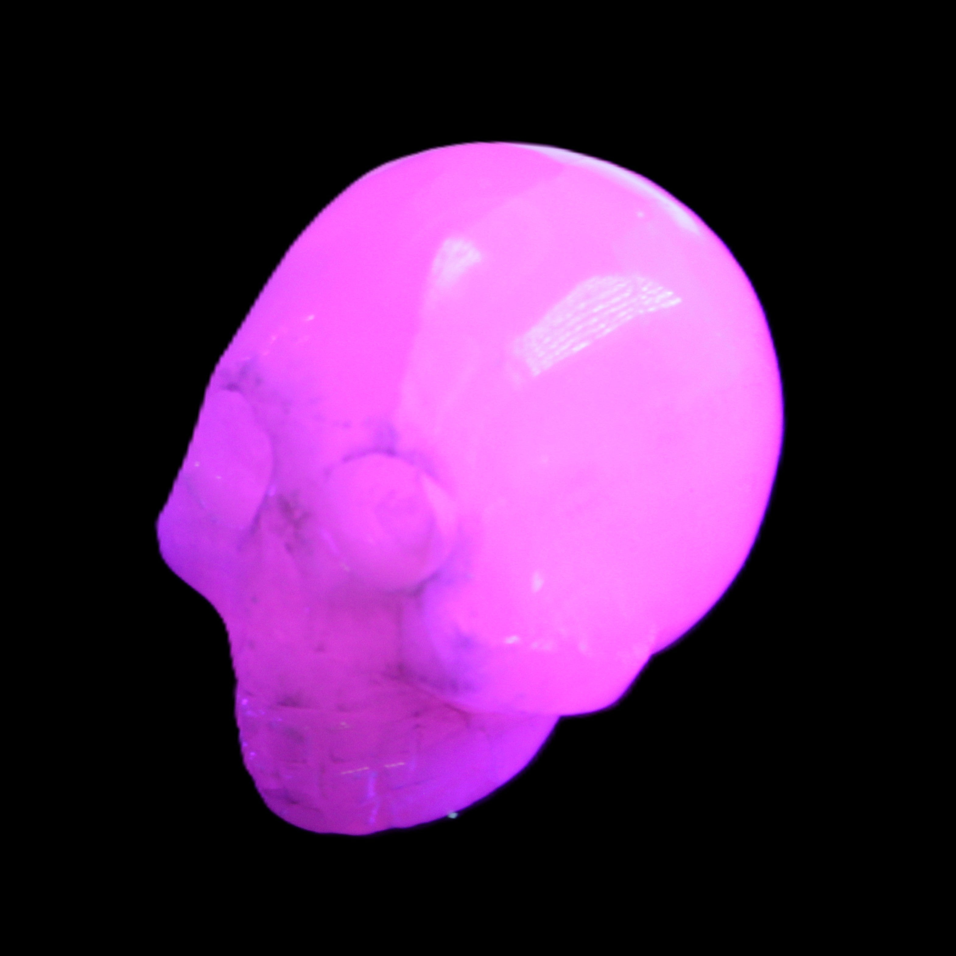 Mangano Calcite skull 30*42*35mm 77g in UV light - Rocks and Things Store
