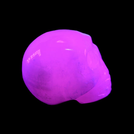 Mangano Calcite skull 30*42*35mm 77g in UV light - Rocks and Things Store