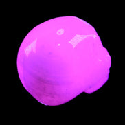 Mangano Calcite skull 30*42*35mm 77g in UV light - Rocks and Things Store