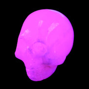 Mangano Calcite skull 30*42*35mm 77g in UV light - Rocks and Things Store