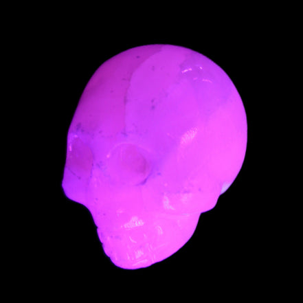 Mangano Calcite skull 30*42*35mm 77g in UV light - Rocks and Things Store