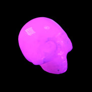 Mangano Calcite skull 30*42*35mm 77g in UV light - Rocks and Things Store