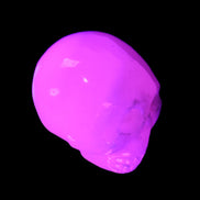 Mangano Calcite skull 30*42*35mm 77g in UV light - Rocks and Things Store