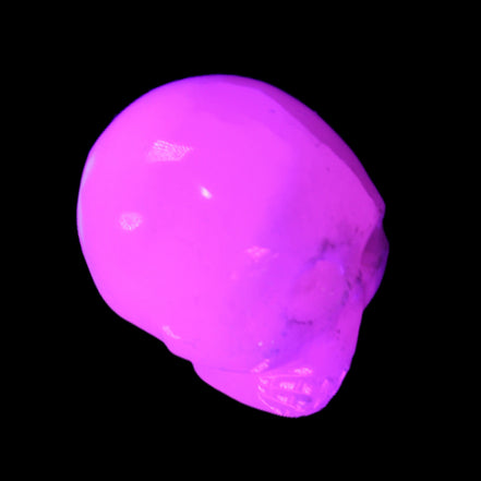 Mangano Calcite skull 30*42*35mm 77g in UV light - Rocks and Things Store