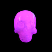 Mangano Calcite skull 30*42*35mm 77g in UV light - Rocks and Things Store