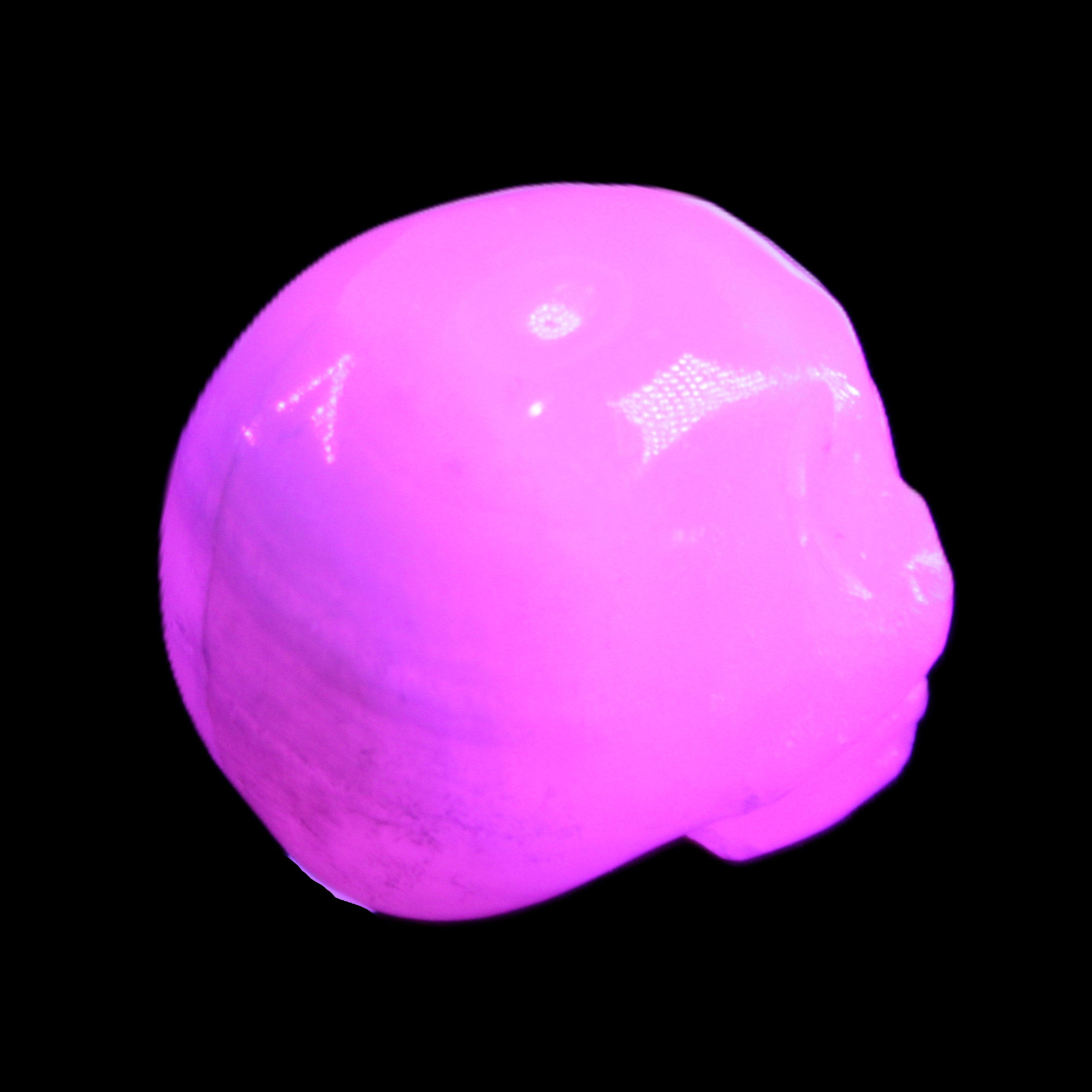 Mangano Calcite skull 30*42*35mm 77g in UV light - Rocks and Things Store