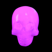 Mangano Calcite skull 30*42*35mm 77g in UV light - Rocks and Things Store