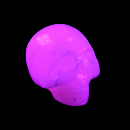 Mangano Calcite skull 30*42*35mm 77g in UV light - Rocks and Things Store