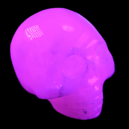 Mangano Calcite skull 30*42*35mm 77g in UV light - Rocks and Things Store