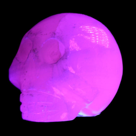 Mangano Calcite skull 30*42*35mm 77g in UV light - Rocks and Things Store