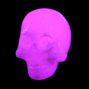 Mangano Calcite skull 30*42*35mm 77g in UV light - Rocks and Things Store