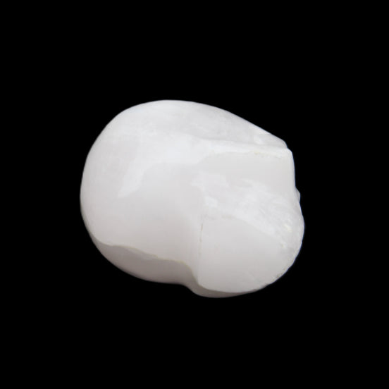 Mangano Calcite skull 30*42*35mm 77g in sunlight - Rocks and Things Store