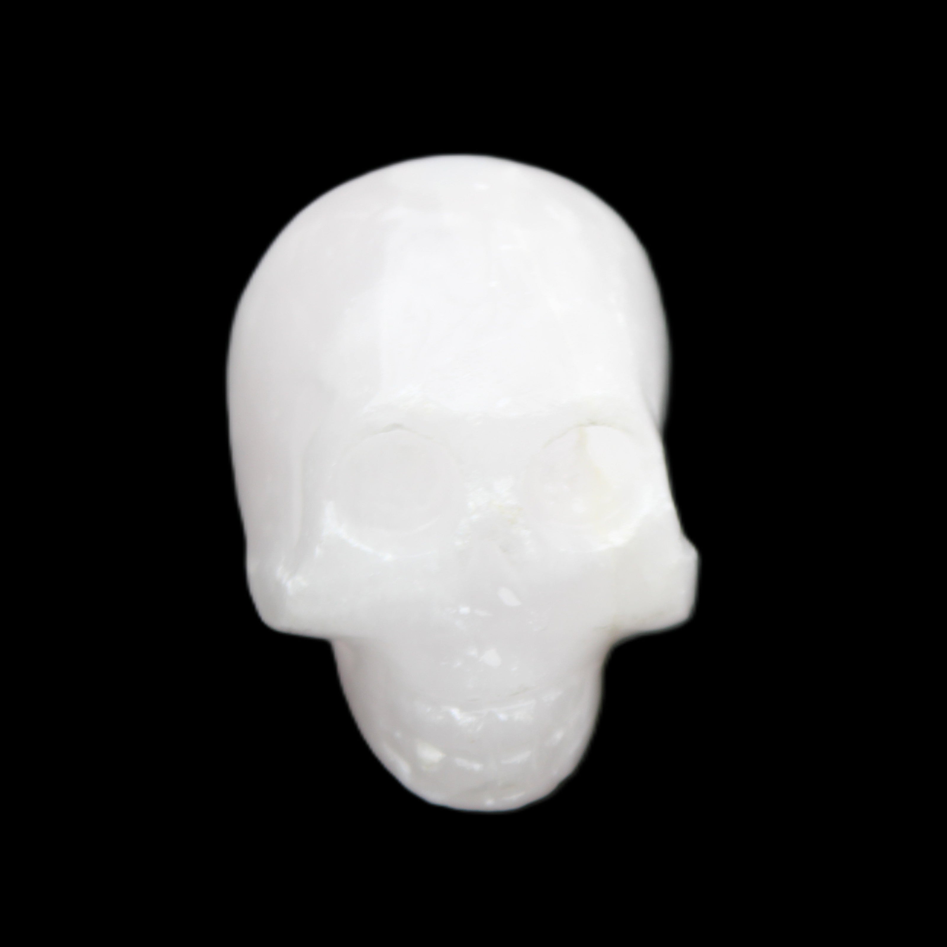 Mangano Calcite skull 30*42*35mm 77g in sunlight - Rocks and Things Store