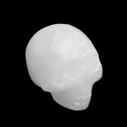 Mangano Calcite skull 30*42*35mm 77g in sunlight - Rocks and Things Store