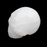 Mangano Calcite skull 30*42*35mm 77g in sunlight - Rocks and Things Store