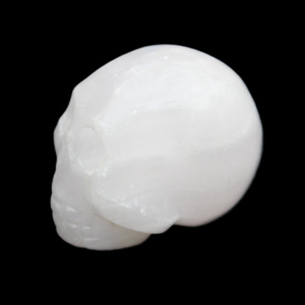 Mangano Calcite skull 30*42*35mm 77g in sunlight - Rocks and Things Store