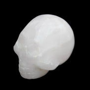 Mangano Calcite skull 30*42*35mm 77g in sunlight - Rocks and Things Store